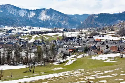an aerial view of a small village in the mountains at Apartma Žvan in Bled