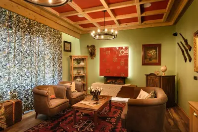 a living room with a couch and chairs and a table at Franz Apartments in Ilirska Bistrica