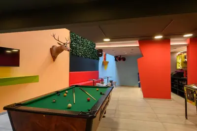 a billiard room with a pool table in the middle at Franz Apartments in Ilirska Bistrica