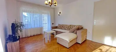a living room with a couch and a chair at Pr Pogorev in Begunje na Gorenjskem