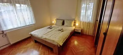 a bedroom with a bed with two teddy bears on it at Pr Pogorev in Begunje na Gorenjskem