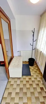 a room with a white couch in a room with a window at Pr Pogorev in Begunje na Gorenjskem