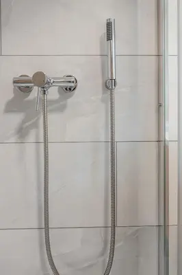 a shower with a glass door in a bathroom at 2 Bedroom Apartment Sima with Seasonal Shared Pool in Ivančna Gorica