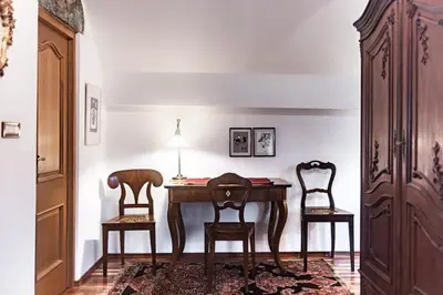 a dining room with a table and two chairs at Historic lake view Bled apartment in Bled