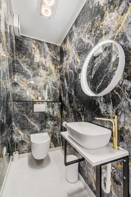 a bathroom with a sink and a mirror at Alps2sea Suite Apartment in Bovec