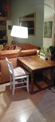 a living room with a table and a chair and a couch at ROSE ROOM for 4 guests in Rose resort Ljubljana in Ljubljana