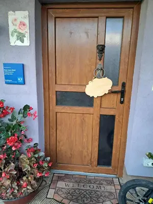 a wooden door with a towel hanging on it at ROSE ROOM for 4 guests in Rose resort Ljubljana in Ljubljana