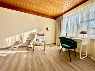 a living room with a desk and a chair at New LunarGlow 3-room Apartment with free parking in Ljubljana