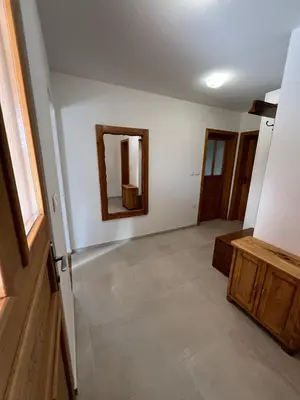 an empty room with a mirror and a hallway at Iža na brejgi in Moravske Toplice