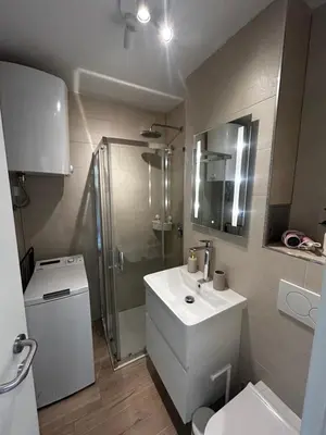 a bathroom with a toilet and a sink and a shower at Velvet Alps Bovec in Bovec
