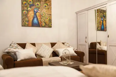 a living room with a couch and a table at Apartments Artorius Laško in Laško