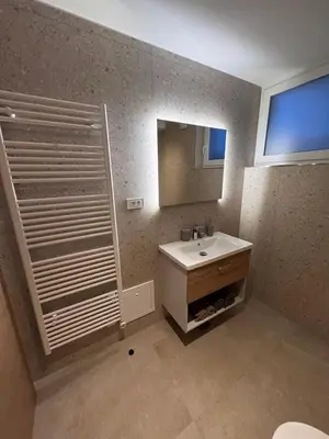 a bathroom with a sink and a mirror at Apartma Oblak in Kranjska Gora