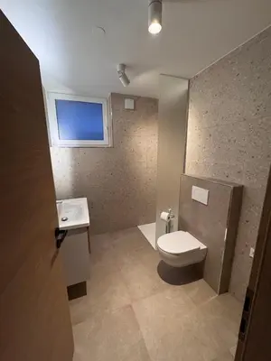a bathroom with a toilet and a sink at Apartma Oblak in Kranjska Gora