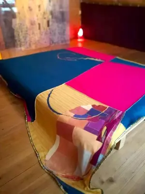 a colorful rug on the floor in a room at Wild Art Wooden house in Ig