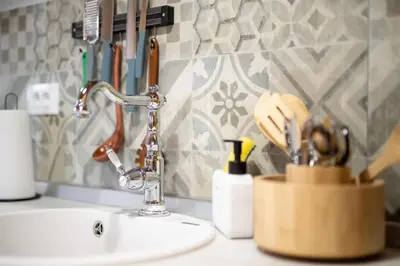 a kitchen counter with a sink and a fosset at Glamping Podgoro - Rogatec in Rogatec