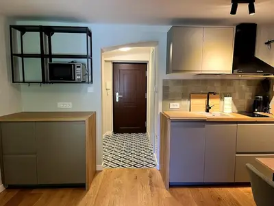 a kitchen with a counter top and a microwave at Old town studio apartment in Ljubljana
