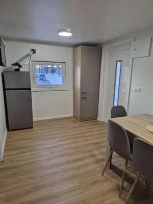 a room with a table and chairs and a window at Hiška Moravska ravnica in Moravske Toplice