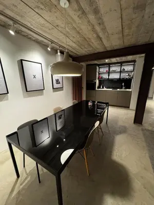 a dining room with a black table and chairs at Magda POP UP in Šentvid pri Stični