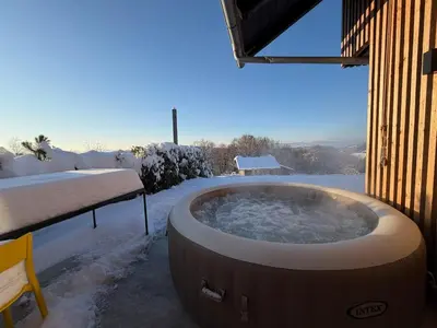a jacuzzi tub in a snow covered yard at Magda POP UP in Šentvid pri Stični