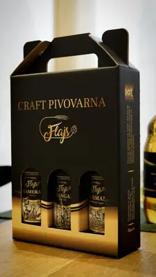 a black box with four bottles of wine at Turistična kmetija in pivovarna Flajs in Žalec