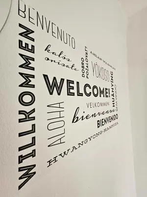 a piece of paper with words on a wall at Loginn Vic in Ljubljana