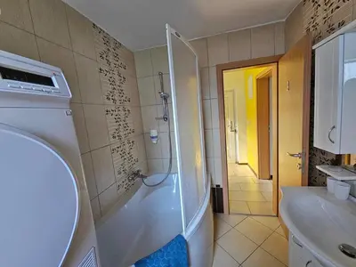 a bathroom with a shower and a sink at Loginn Vic in Ljubljana