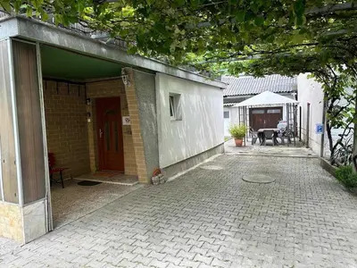 an open door of a house with a patio at Loginn Vic in Ljubljana