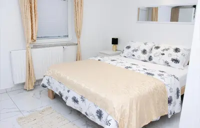 a bedroom with two beds and a window at Gostišče cimi in Kozina