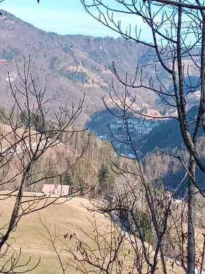 a view of a valley in the mountains at Apartma pri Ivanu in Spodnja Idrija