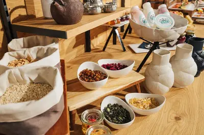 a group of bowls of food and vases on shelves at Guesthouse Grof in Vransko