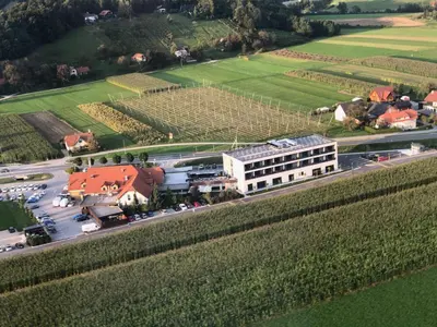an aerial view of a building and a parking lot at Guesthouse Grof in Vransko