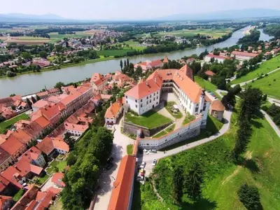 an aerial view of a building next to a river at Holiday Home Urlaub für die Seele - Ferienhaus mit Sauna by Interhome in Rucmanci