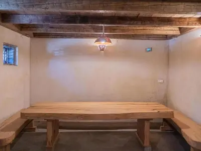 a wooden table in a room with a ceiling at Apartment Natur- und Weinresort Lipej by Interhome in Bizeljsko