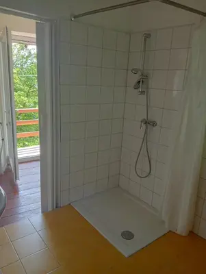 a bathroom with a shower with a shower at Vale