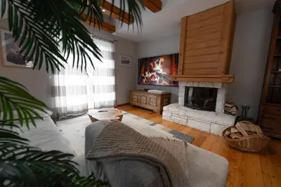 a living room with a couch and a fireplace at Apartma Mauro in Kranjska Gora