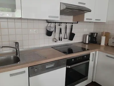 a kitchen with a sink and a stove top oven at Apartment Berglez in Škofja Loka