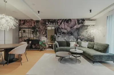 a living room with a couch and a table at City Residence in Ljubljana