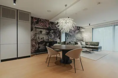 a living room with a table and chairs and a couch at City Residence in Ljubljana