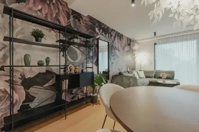 a living room with a table and a couch at City Residence in Ljubljana
