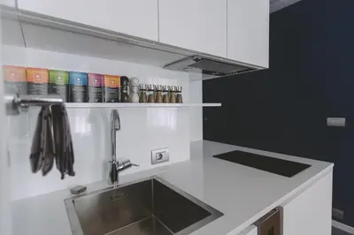 a kitchen with a sink and a counter top at Dragon's Den in Ljubljana