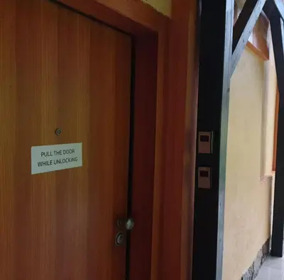 a sign on a door that reads till the guest will misuse at Tivoli Double in Ljubljana