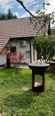 a bird bath in the yard of a house at Holiday Cabin near Ljubljana - Hawknest