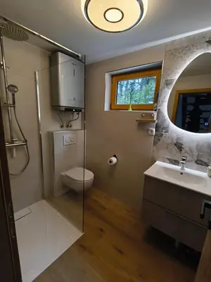 a bathroom with a shower and a sink and a toilet at Holiday Cabin near Ljubljana - Hawknest