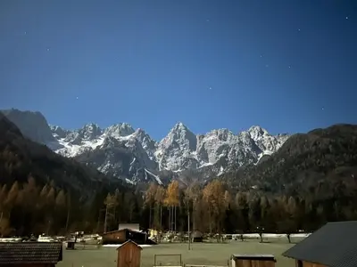a view of a mountain range with snow covered mountains at Apartment Barbara with sauna in Gozd Martuljek
