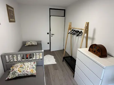 a bedroom with a bunk bed and a closet at Mary's flat in Ljubljana