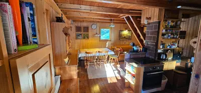 a kitchen and dining room with a table and chairs at Holiday cottage Pod Smreko in Cerklje na Gorenjskem