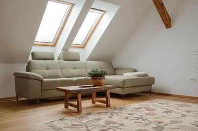 a living room with a couch and a table at Apartmaji Matec in Fala