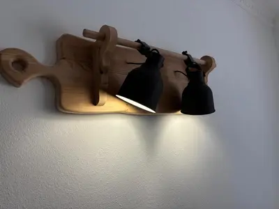 a wooden shelf with two black bells hanging on a wall at Vila Marla in Hrušica
