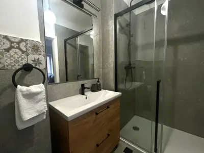 a bathroom with a sink and a shower at Vila Marla in Hrušica