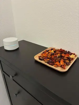 a cutting board with a pizza on a counter at Vila Marla in Hrušica